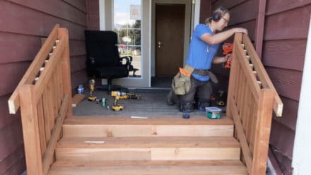 Photo of contractor working on the deck stairs
